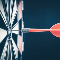 Dart pinned to a dart board