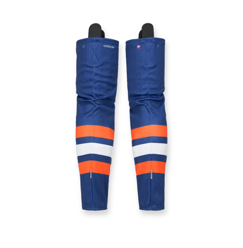Two blue, orange, and white ice hockey shin guards from owayo with the text 'ULTRADRY' and '3D' on the back.