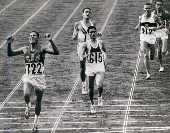 Runners crossing the finish line at the 1964 Olympics