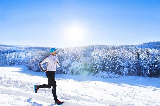 Jogger in a snow-covered landscape