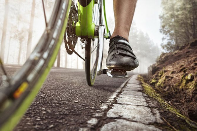 Racing bike pedals on a road