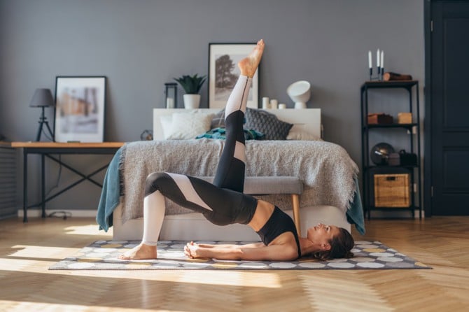 Woman doing exercises to relieve back pain.