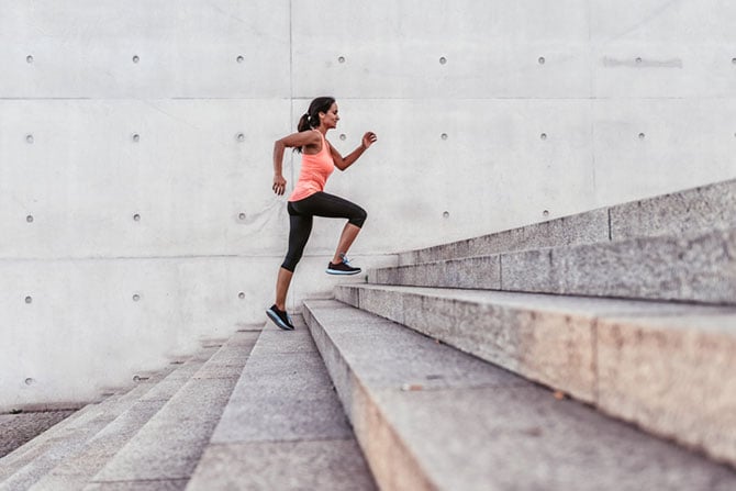 Women running up a series of steps quickly