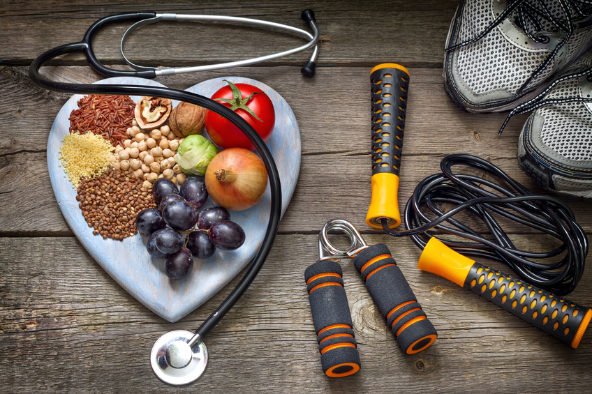 Sports shoes, stethoscope, skipping rope and healthy food
