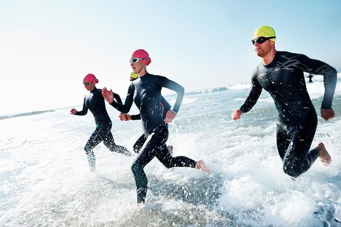 Triathletes going for a swim