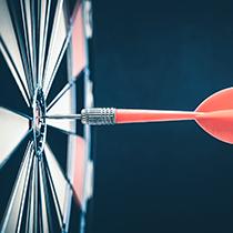 Dart pinned to a dart board